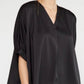 A Satin V Neck Plus top featuring wide, elbow-length sleeves. Available in plus sizes.