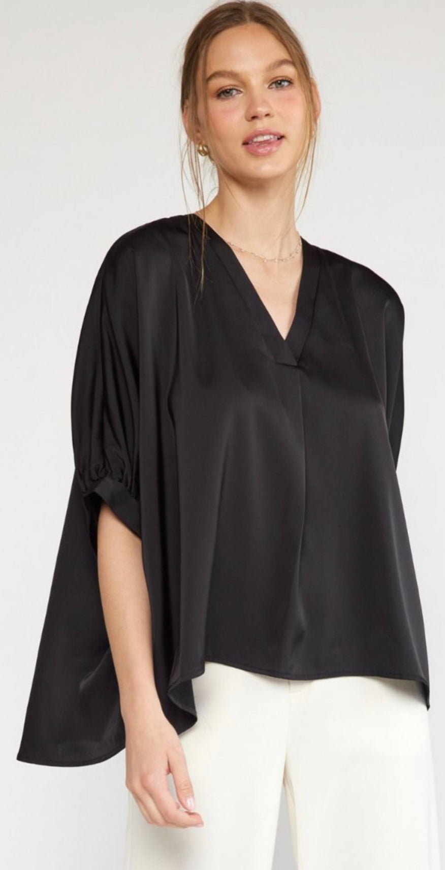 A Satin V Neck Plus top featuring wide, elbow-length sleeves. Available in plus sizes.